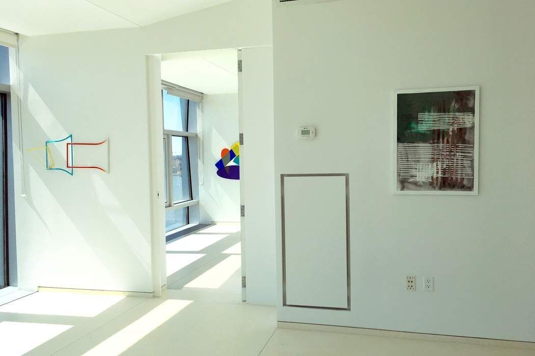 100 11th Avenue, Unit 16C Manhattan, NY 10011 - Photo 15 of 20 a view of a hallway with wooden floor and a living room