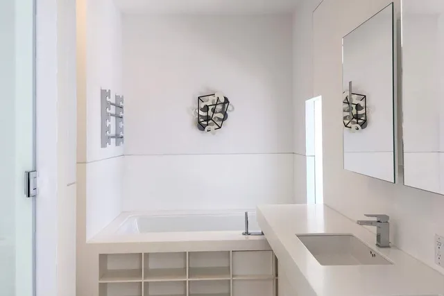 a bathroom with a bathtub and sink