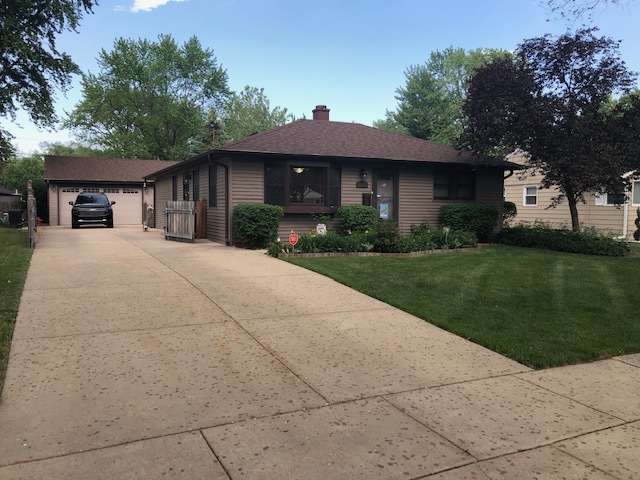 3718 Wren Lane Rolling Meadows, IL 60008 - Photo 1 of 1 a front view of a house with a yard and potted plants