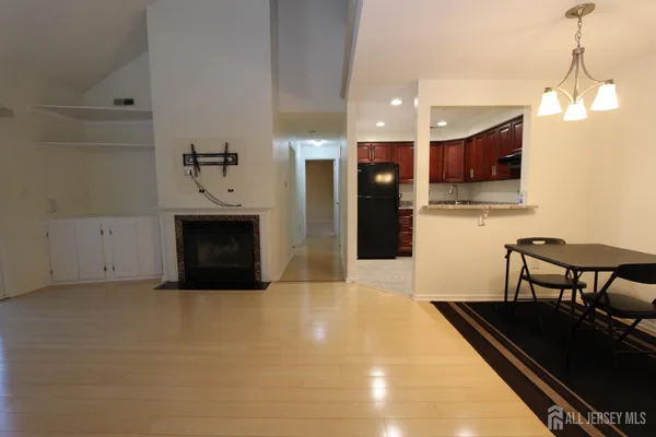 a kitchen with furniture and a fireplace