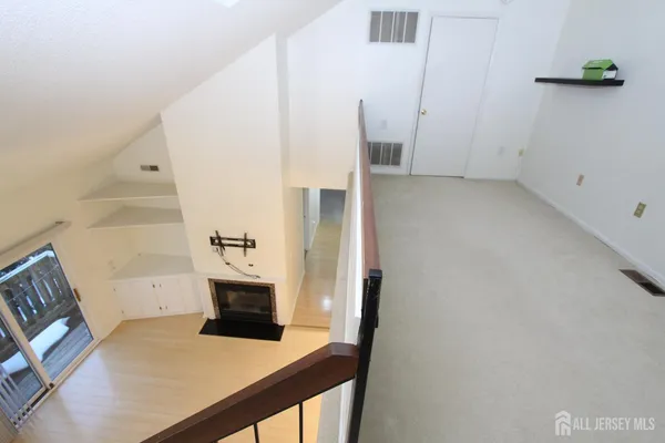 a view of living room with furniture and flat screen tv