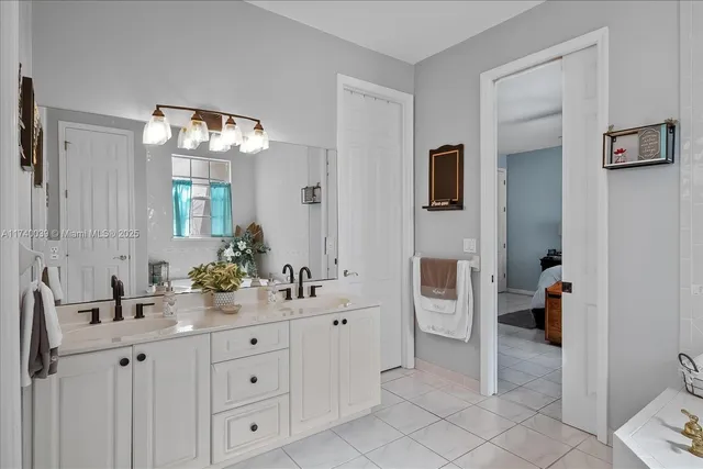 a bathroom with a double vanity sink and a mirror