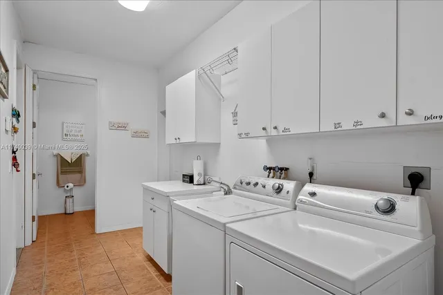 a view of storage and utility room with washer and dryer