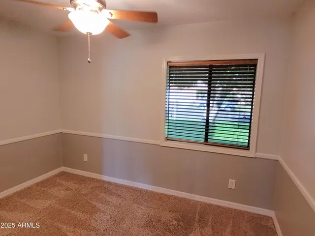 a view of a room that has a window in it
