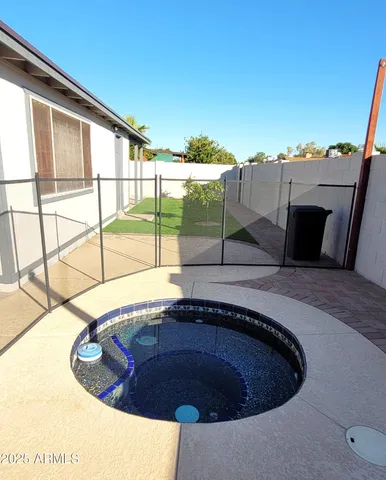 a swimming pool with an outdoor seating