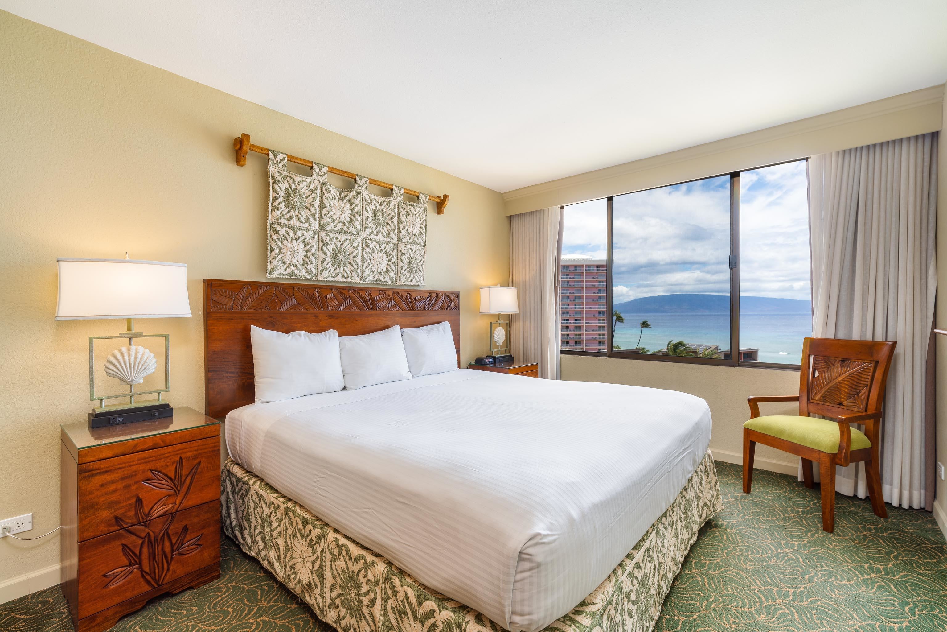 3445 Lower Honoapiilani Road, Unit 905 Lahaina, HI 96761 - Photo 13 of 30 a bedroom with a bed and glass window