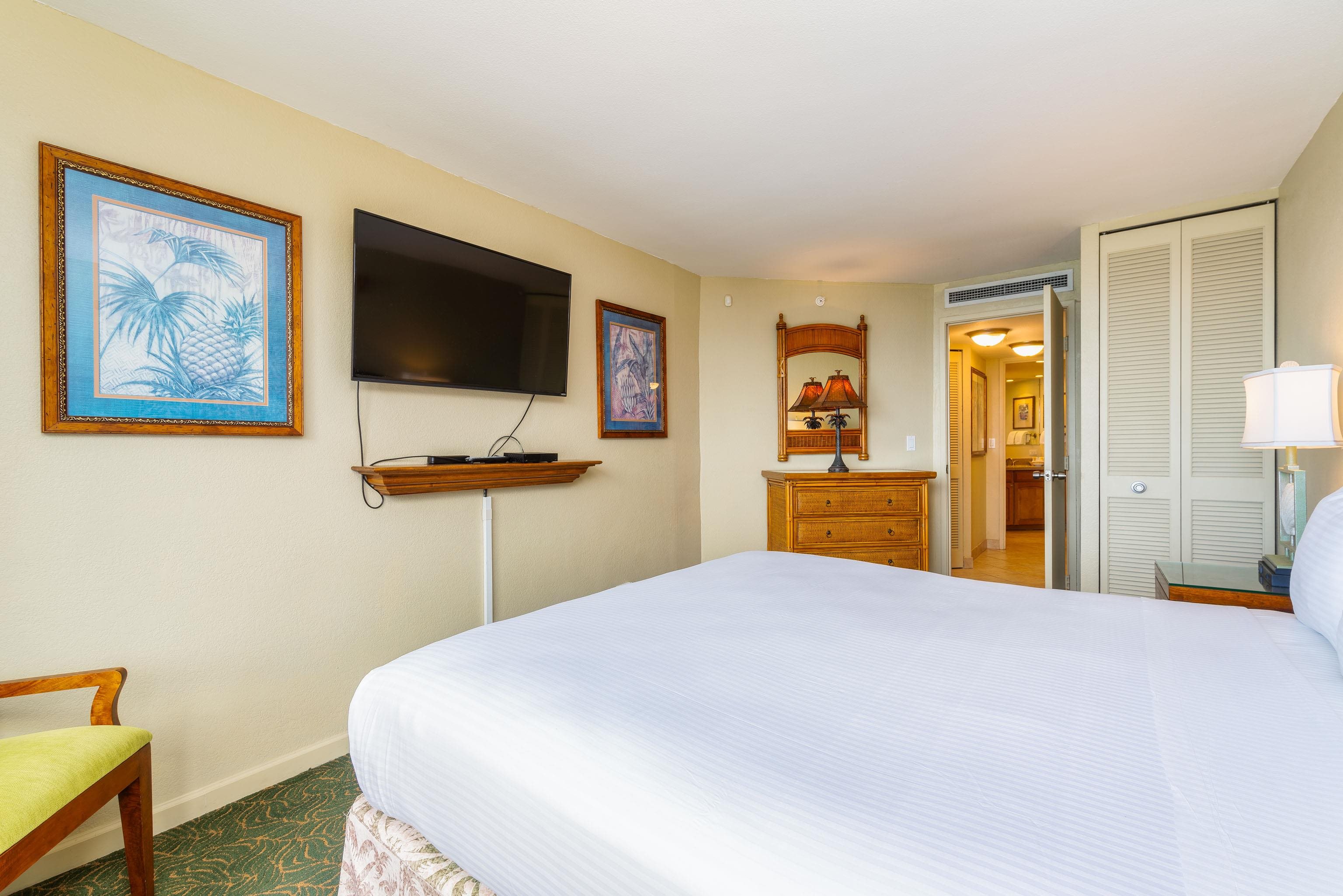 3445 Lower Honoapiilani Road, Unit 905 Lahaina, HI 96761 - Photo 15 of 30 a bedroom with a bed and a flat screen tv