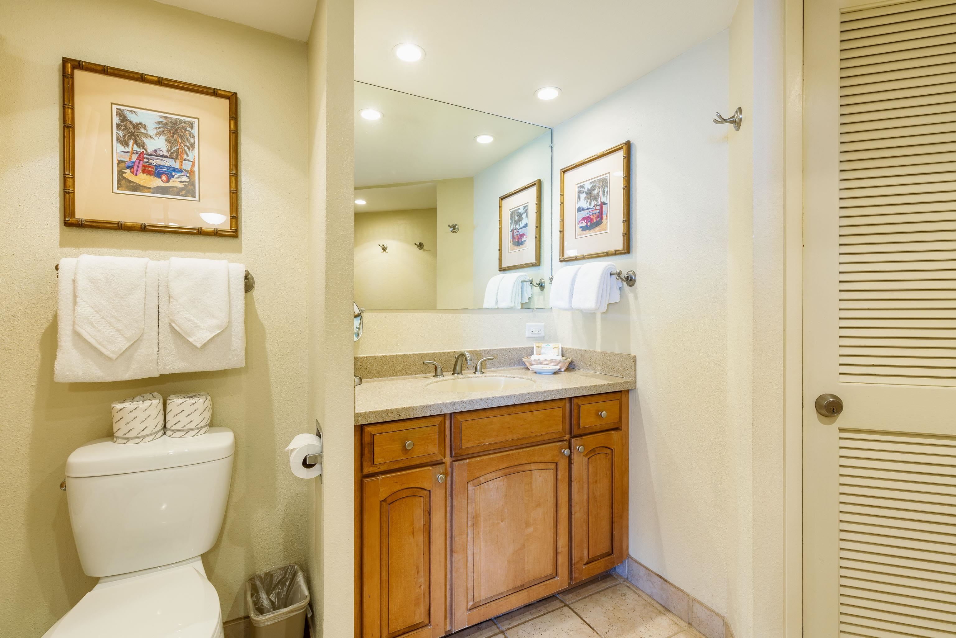 3445 Lower Honoapiilani Road, Unit 905 Lahaina, HI 96761 - Photo 17 of 30 a bathroom with a toilet sink and mirror