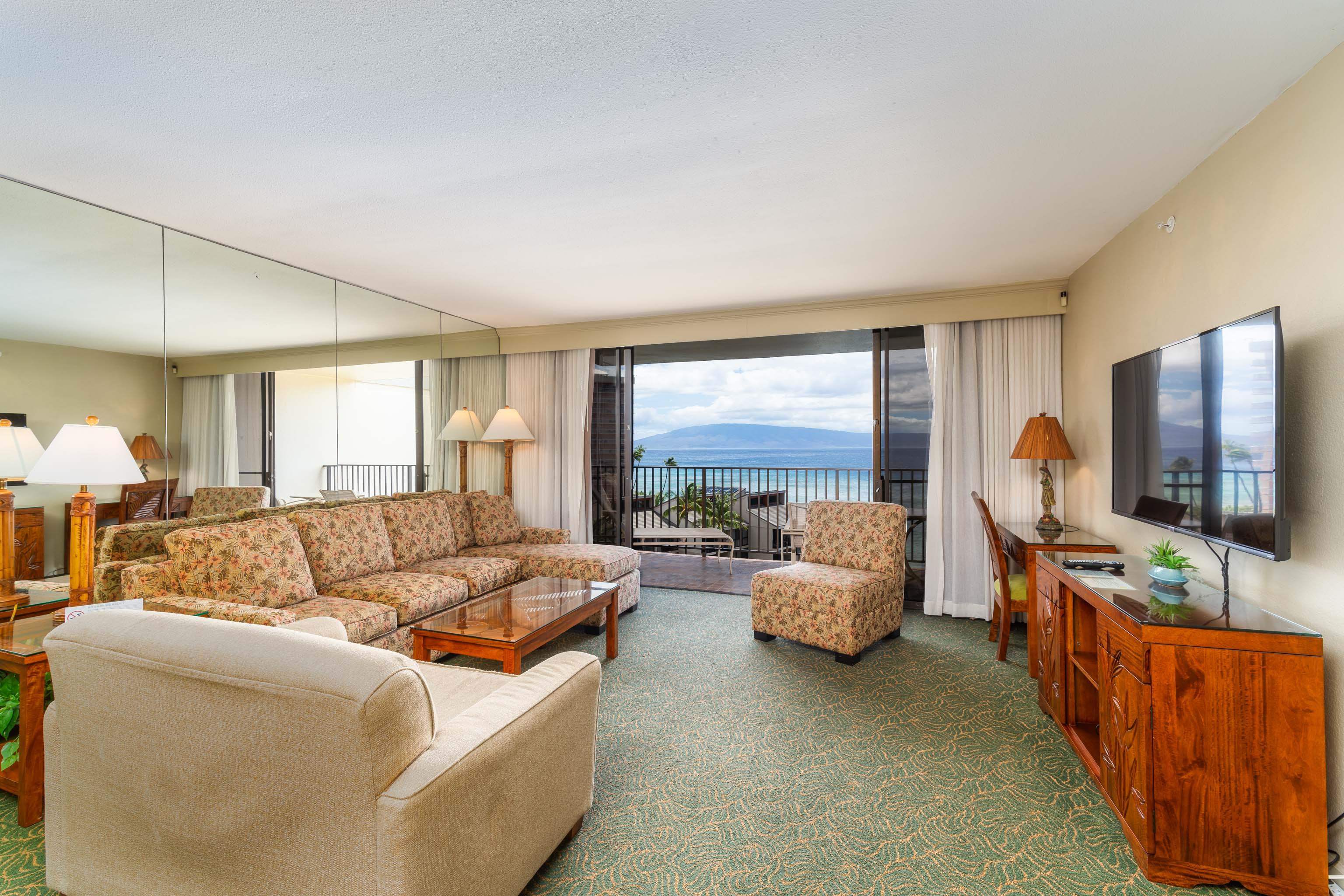 3445 Lower Honoapiilani Road, Unit 905 Lahaina, HI 96761 - Photo 2 of 30 a living room with furniture and a flat screen tv