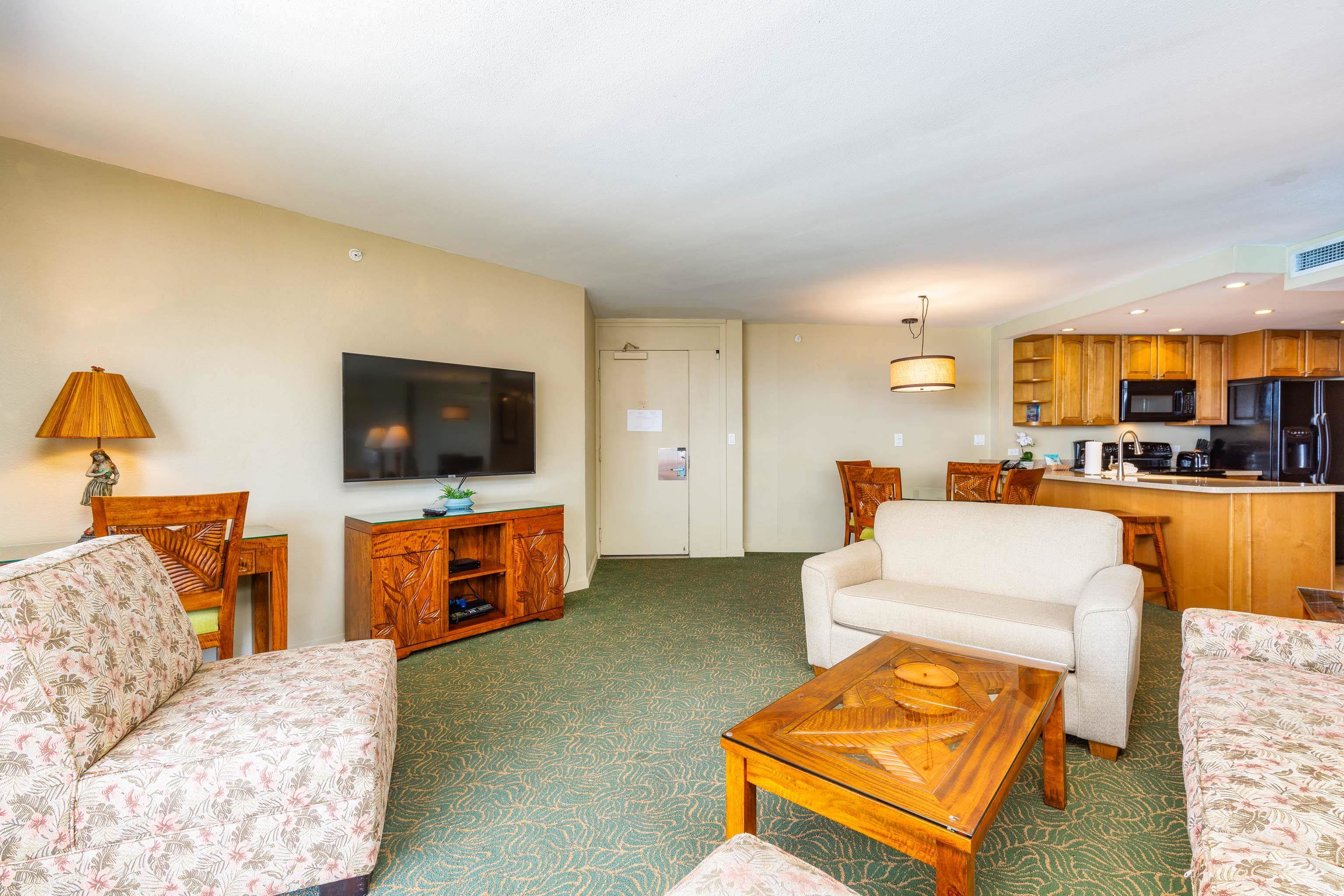 3445 Lower Honoapiilani Road, Unit 905 Lahaina, HI 96761 - Photo 6 of 30 a living room with furniture and a flat screen tv