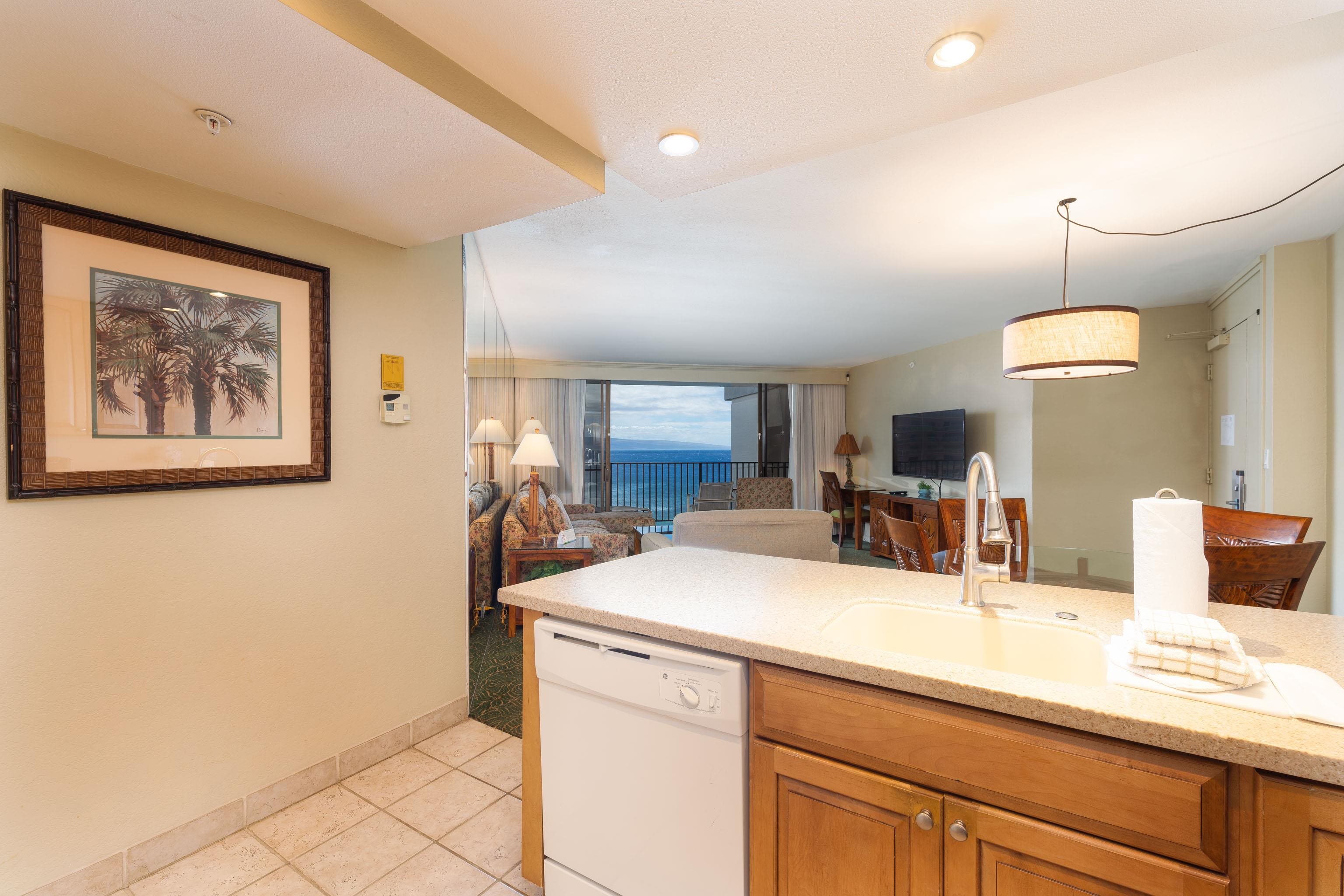 3445 Lower Honoapiilani Road, Unit 905 Lahaina, HI 96761 - Photo 9 of 30 a view of a kitchen with a sink and a refrigerator