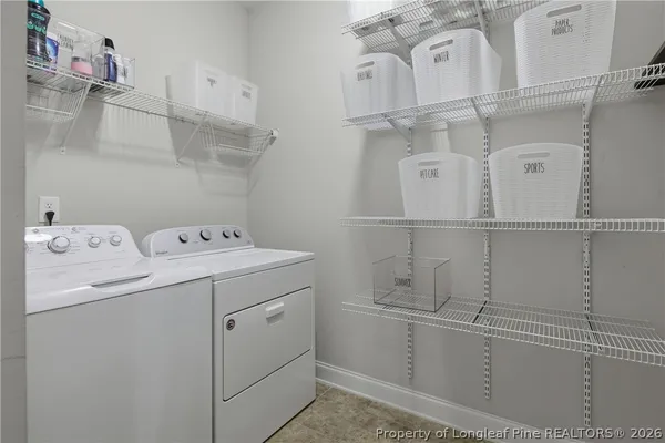 a utility room with dryer and washer