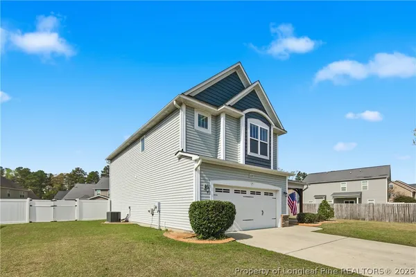 a front view of a house with a yard