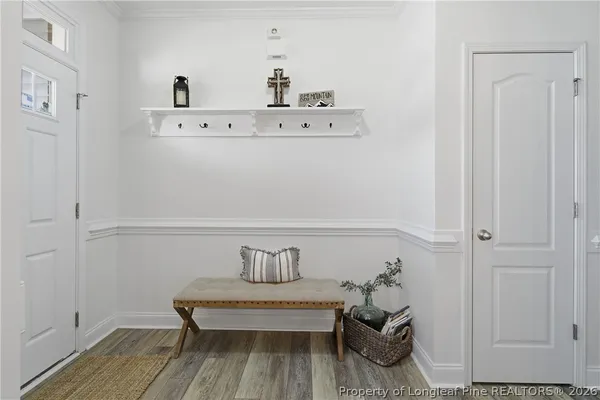 a view of dining room with furniture and wooden floor