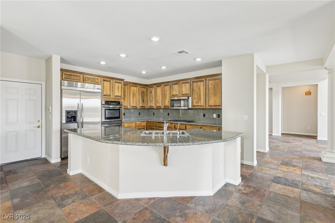 6188 Windfresh Drive Las Vegas, NV 89148 - Photo 22 of 94 Kitchen featuring green granite counter and backsp