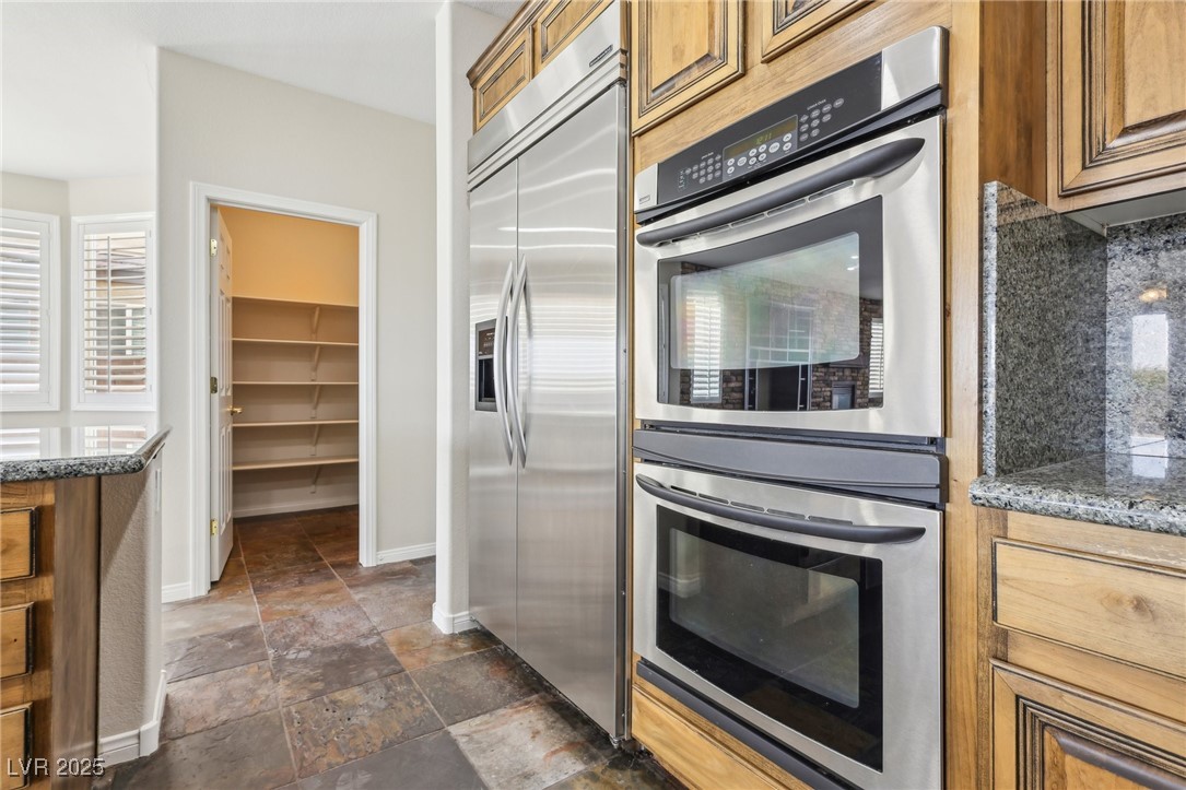 6188 Windfresh Drive Las Vegas, NV 89148 - Photo 28 of 94 View in kitchen toward the walk-in pantry.