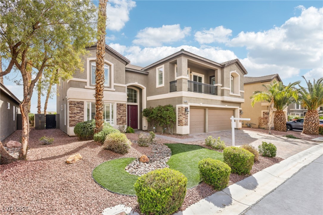 6188 Windfresh Drive Las Vegas, NV 89148 - Photo 3 of 94 View of front of house with stucco siding, a balco