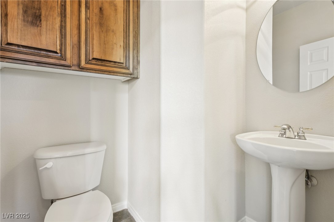 6188 Windfresh Drive Las Vegas, NV 89148 - Photo 34 of 94 Downstairs half bath adjacent to the formal living