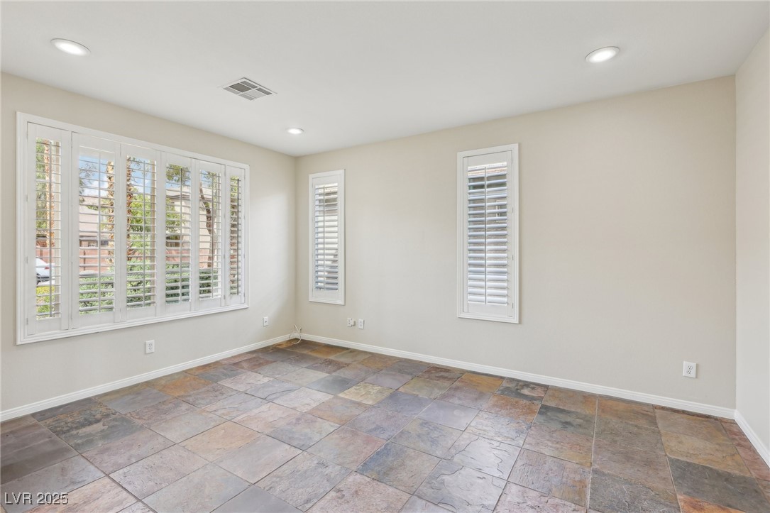 6188 Windfresh Drive Las Vegas, NV 89148 - Photo 35 of 94 Large downstairs den off of the entry.