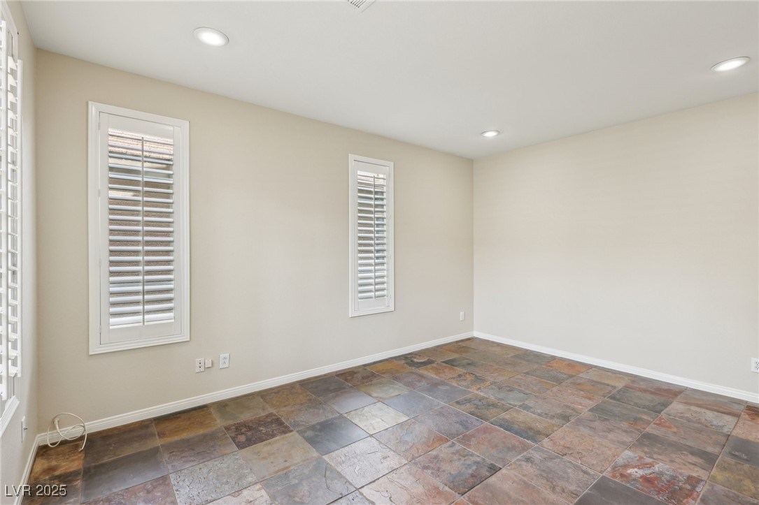 6188 Windfresh Drive Las Vegas, NV 89148 - Photo 36 of 94 Large downstairs den with slate flooring.
