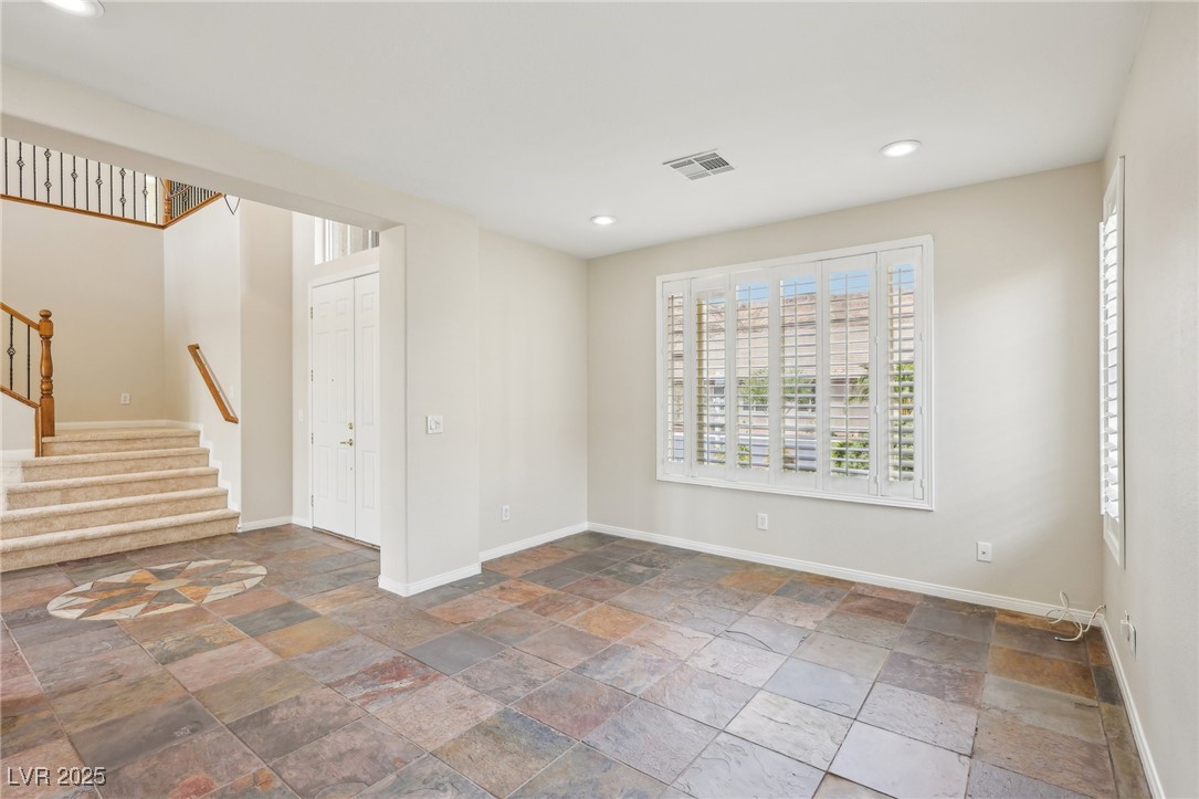 6188 Windfresh Drive Las Vegas, NV 89148 - Photo 37 of 94 View of den toward front doors.