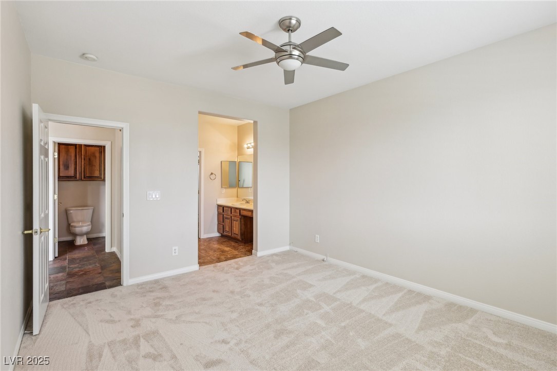 6188 Windfresh Drive Las Vegas, NV 89148 - Photo 40 of 94 Downstairs bedroom and attached bath with a view o