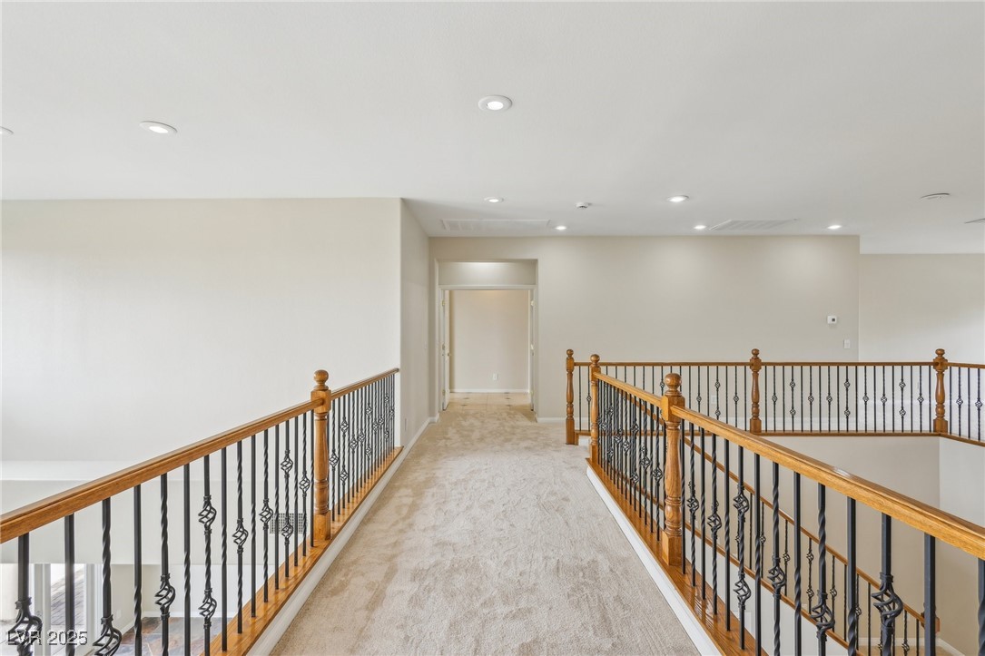 6188 Windfresh Drive Las Vegas, NV 89148 - Photo 45 of 94 View on upper corridor toward the primary suite.