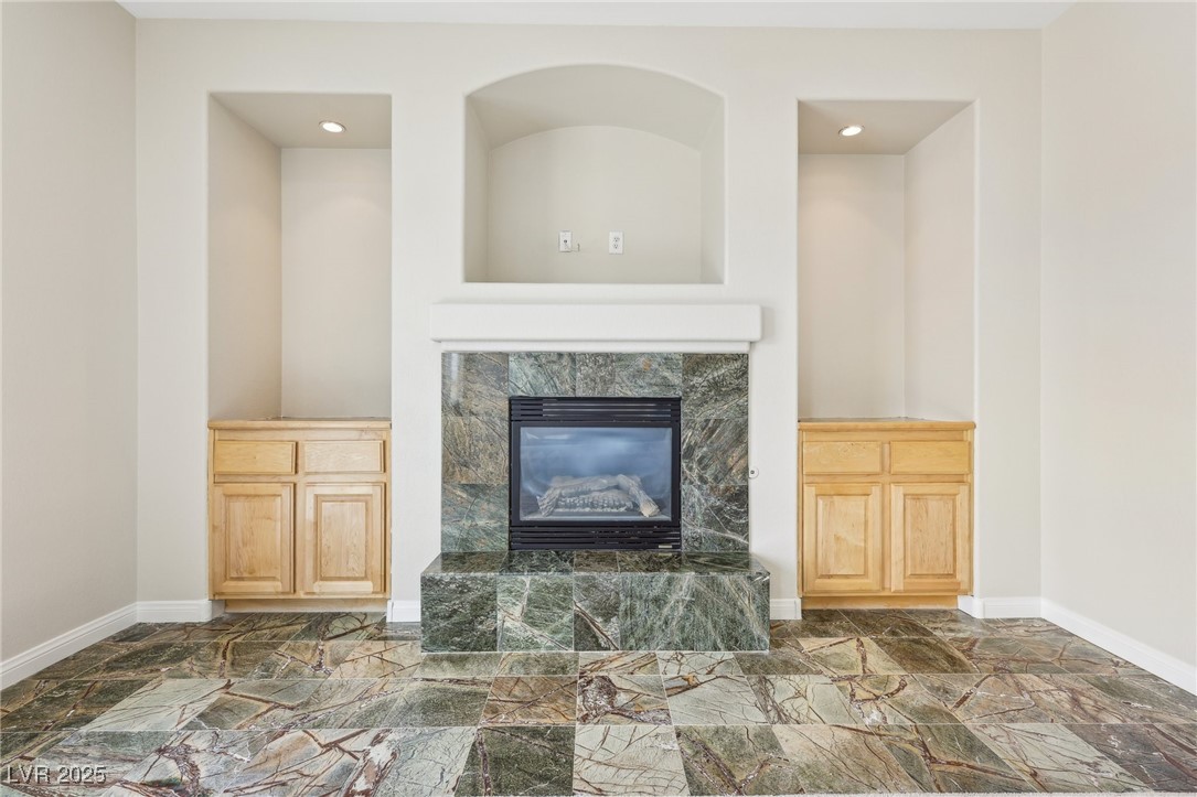 6188 Windfresh Drive Las Vegas, NV 89148 - Photo 49 of 94 Built-in cabinetry and marble fireplace of the pri