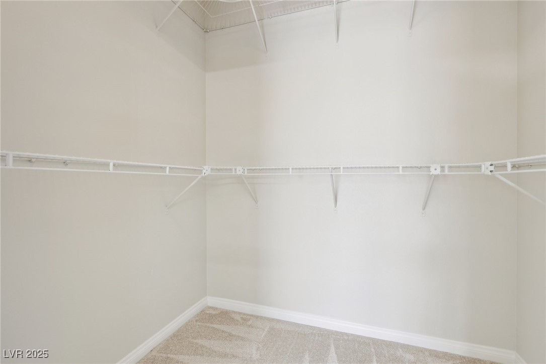 6188 Windfresh Drive Las Vegas, NV 89148 - Photo 62 of 94 Walk in closet featuring carpet floors