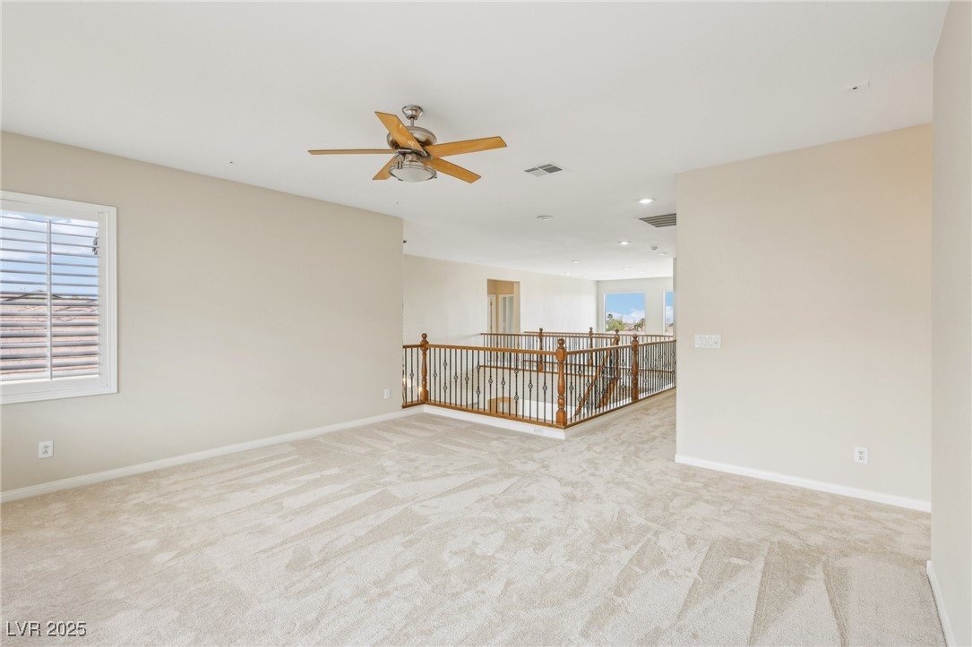 6188 Windfresh Drive Las Vegas, NV 89148 - Photo 68 of 94 Loft with view towards stairs.