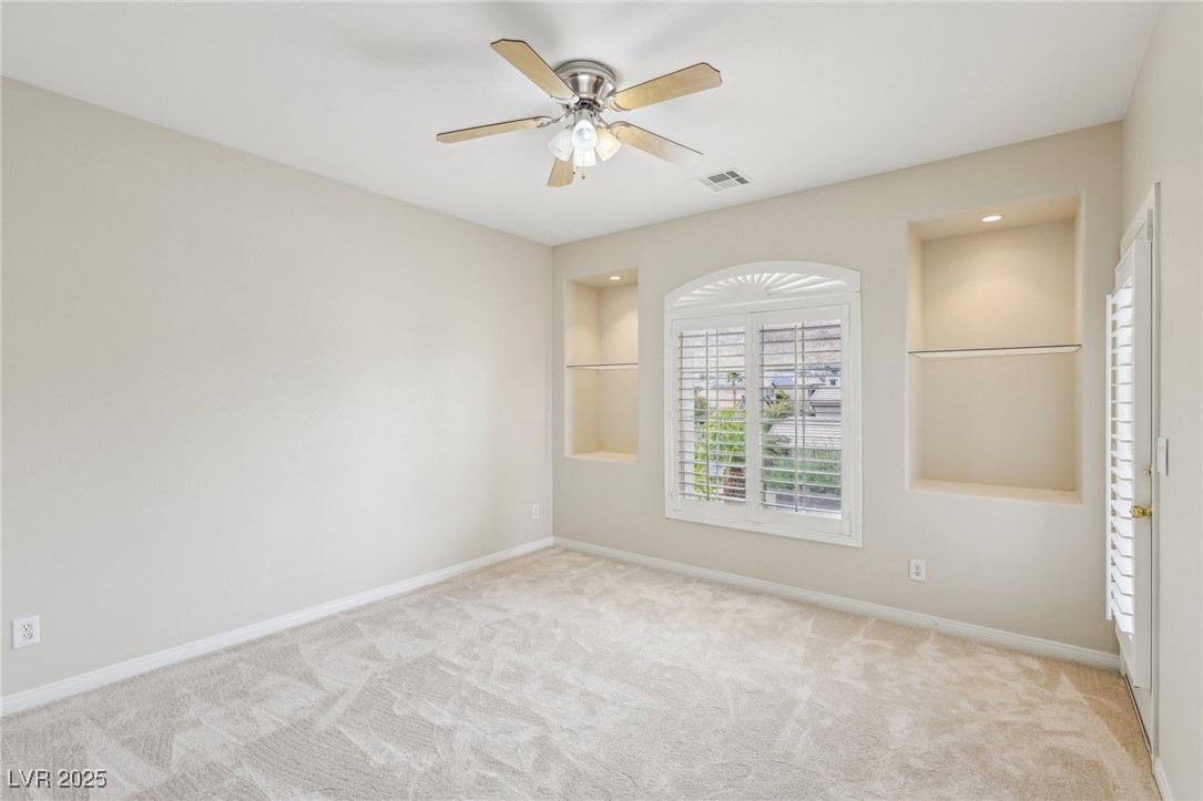 6188 Windfresh Drive Las Vegas, NV 89148 - Photo 71 of 94 Bedroom off of loft area with art shelves and dire