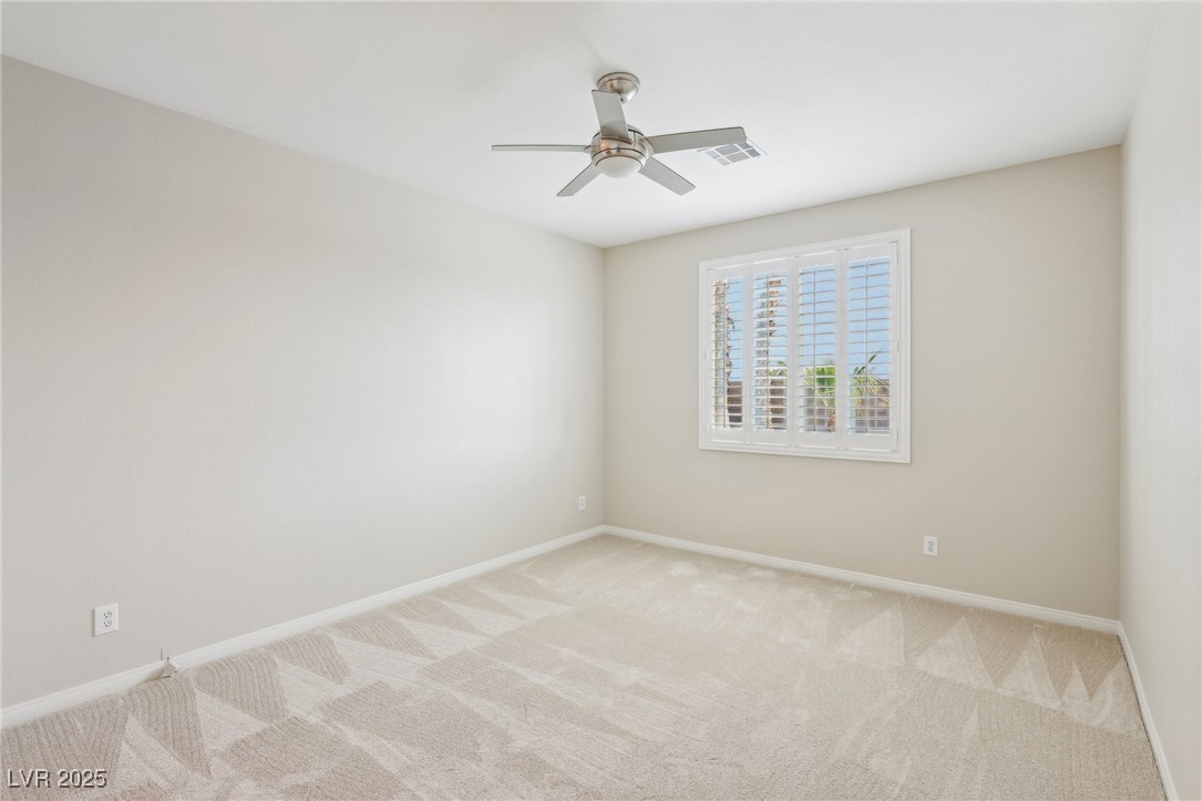 6188 Windfresh Drive Las Vegas, NV 89148 - Photo 76 of 94 Bedroom to the rear of the home.