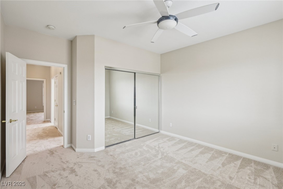 6188 Windfresh Drive Las Vegas, NV 89148 - Photo 77 of 94 Bedroom at rear of home with mirror closet doors.