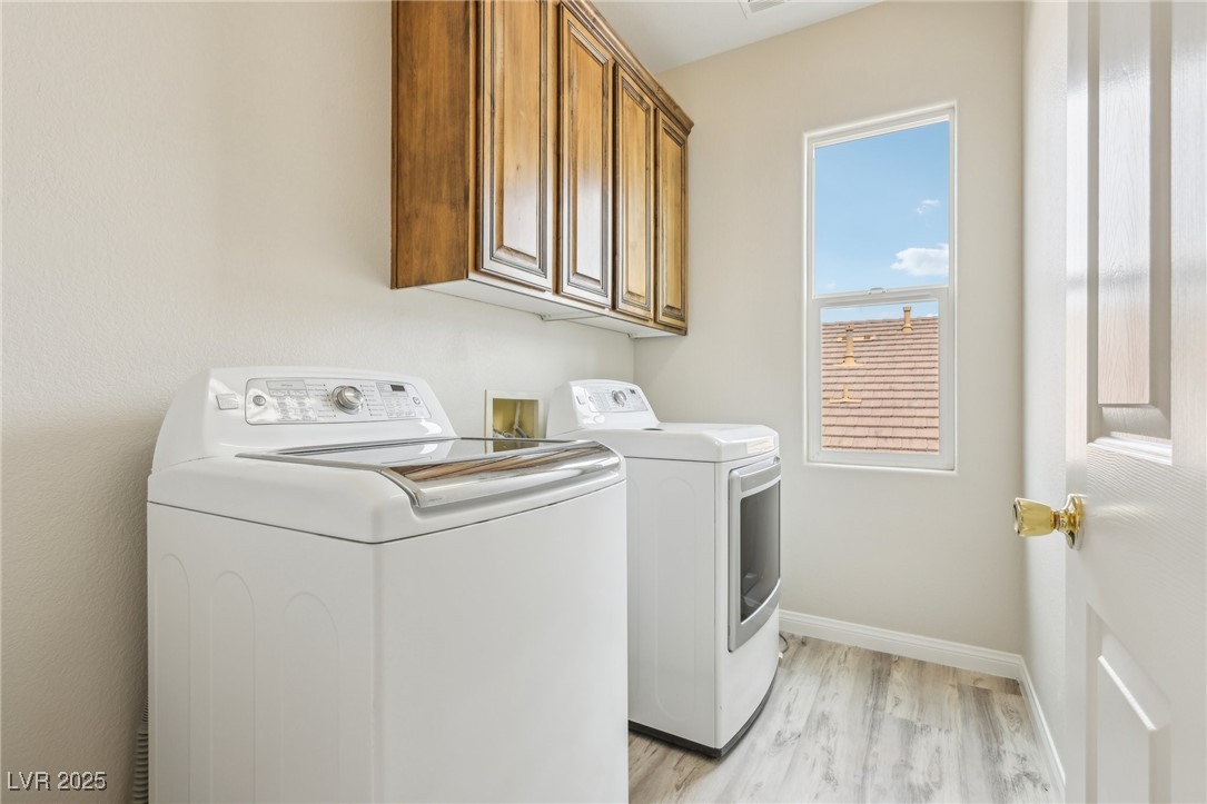 6188 Windfresh Drive Las Vegas, NV 89148 - Photo 78 of 94 Laundry area featuring light wood-style flooring,