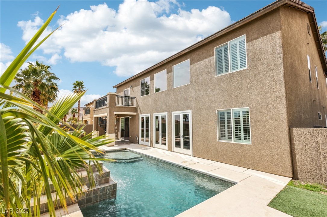 6188 Windfresh Drive Las Vegas, NV 89148 - Photo 85 of 94 Back of property featuring a balcony, an outdoor p