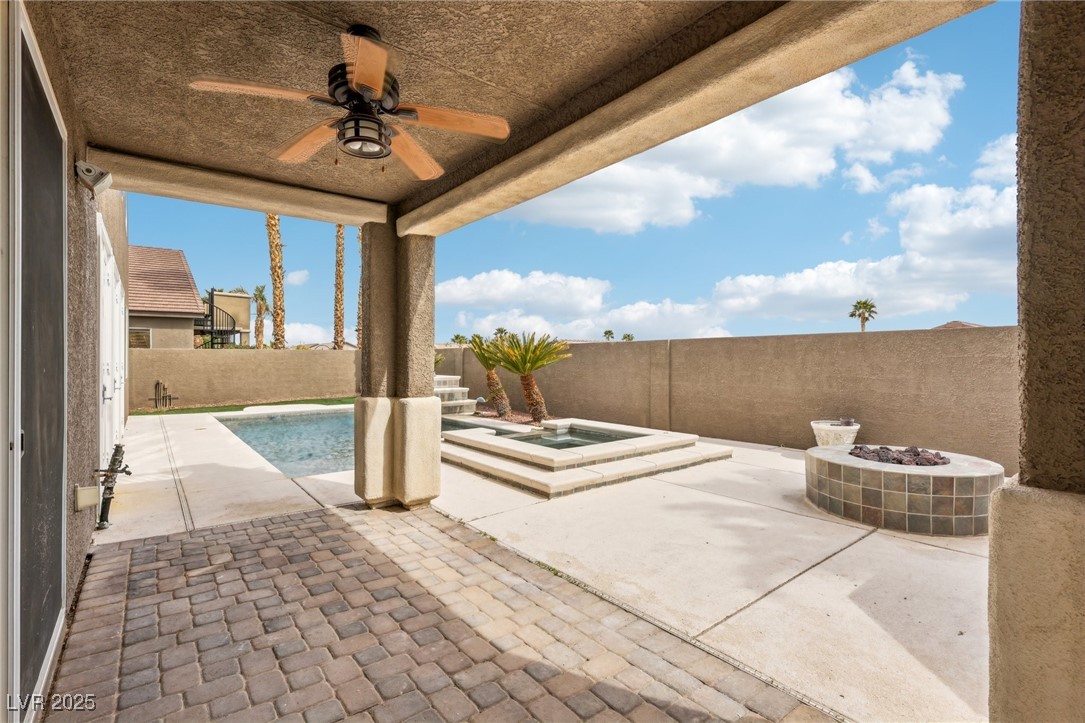 6188 Windfresh Drive Las Vegas, NV 89148 - Photo 89 of 94 Covered pavered patio featuring a ceiling fan