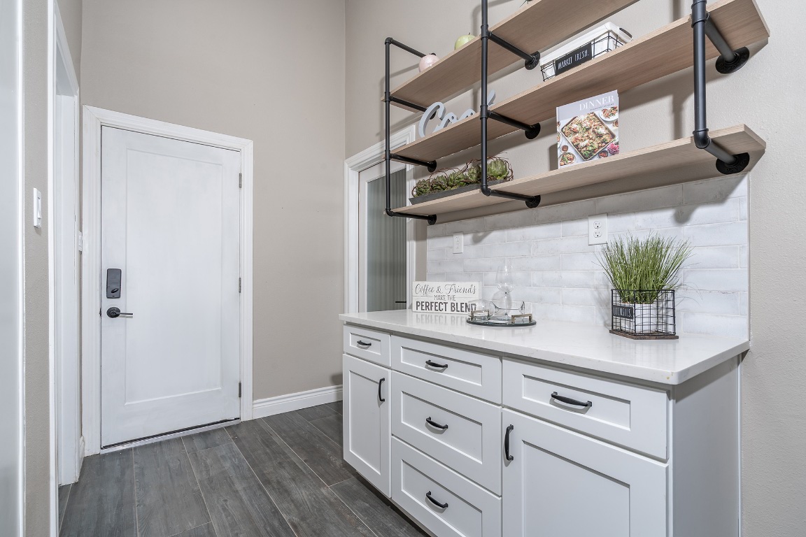 444 Logan Ranch Road Georgetown, TX 78628 - Photo 12 of 36 a view of cabinets and wooden floor