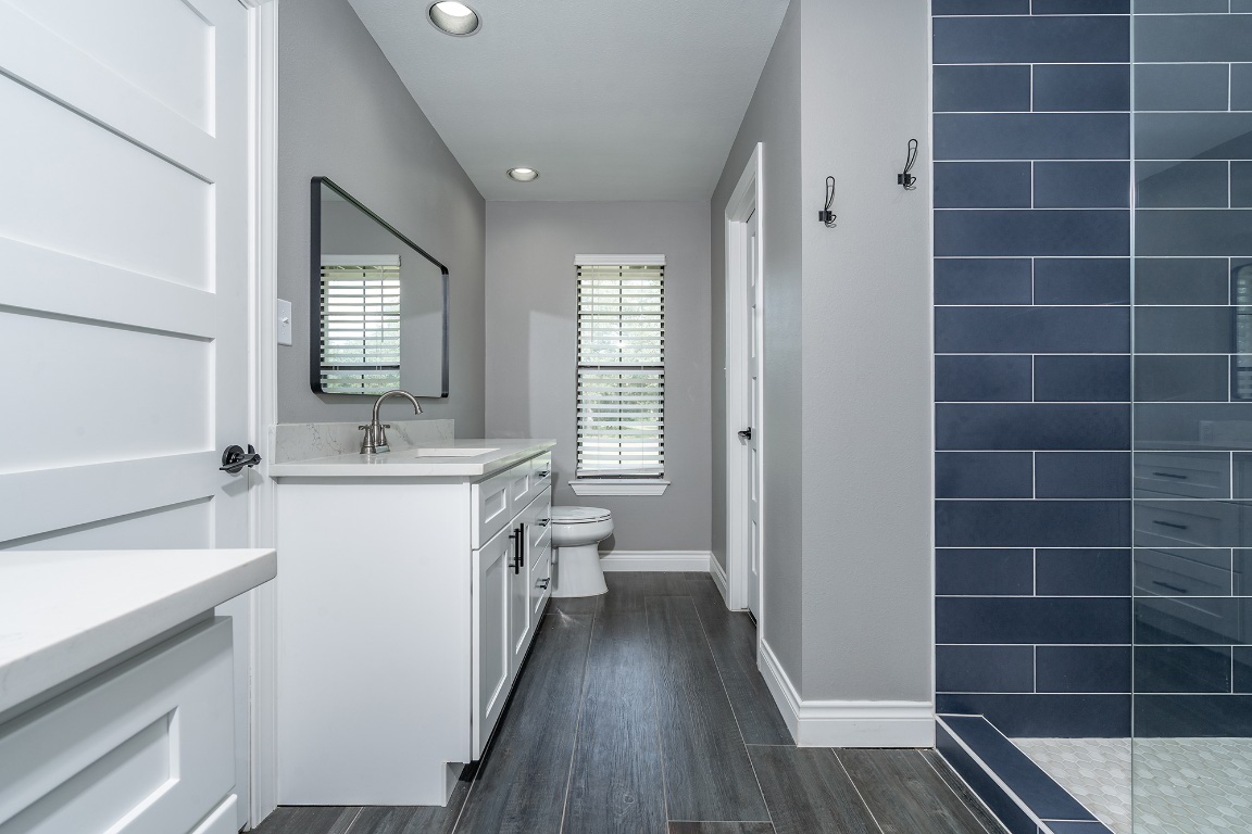 444 Logan Ranch Road Georgetown, TX 78628 - Photo 18 of 36 a bathroom with a sink a toilet and shower
