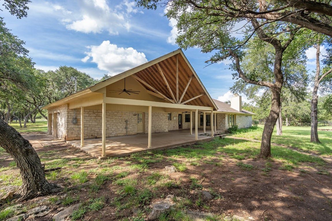 444 Logan Ranch Road Georgetown, TX 78628 - Photo 26 of 36 a view of a house with a yard