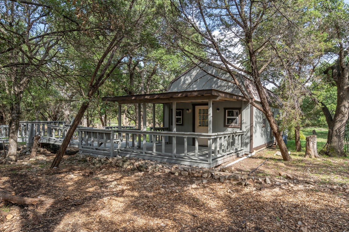 444 Logan Ranch Road Georgetown, TX 78628 - Photo 29 of 36 a front view of a house with a yard