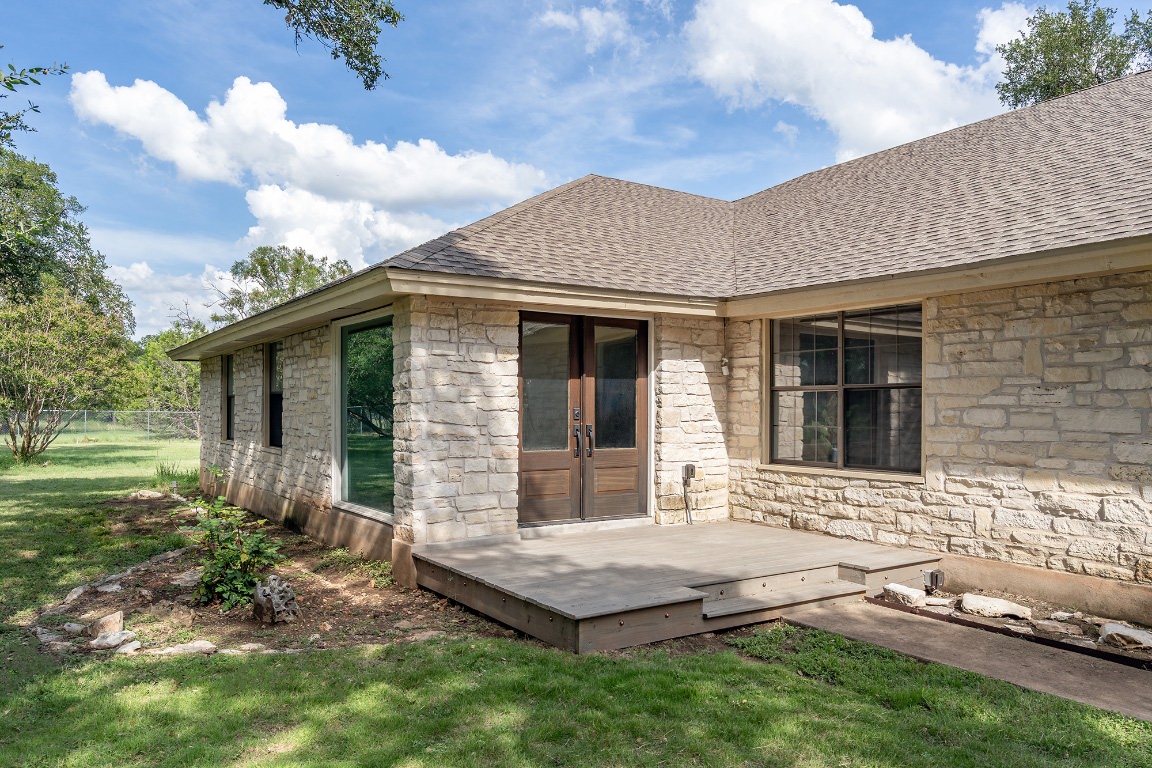 444 Logan Ranch Road Georgetown, TX 78628 - Photo 4 of 36 a front view of a house with garden