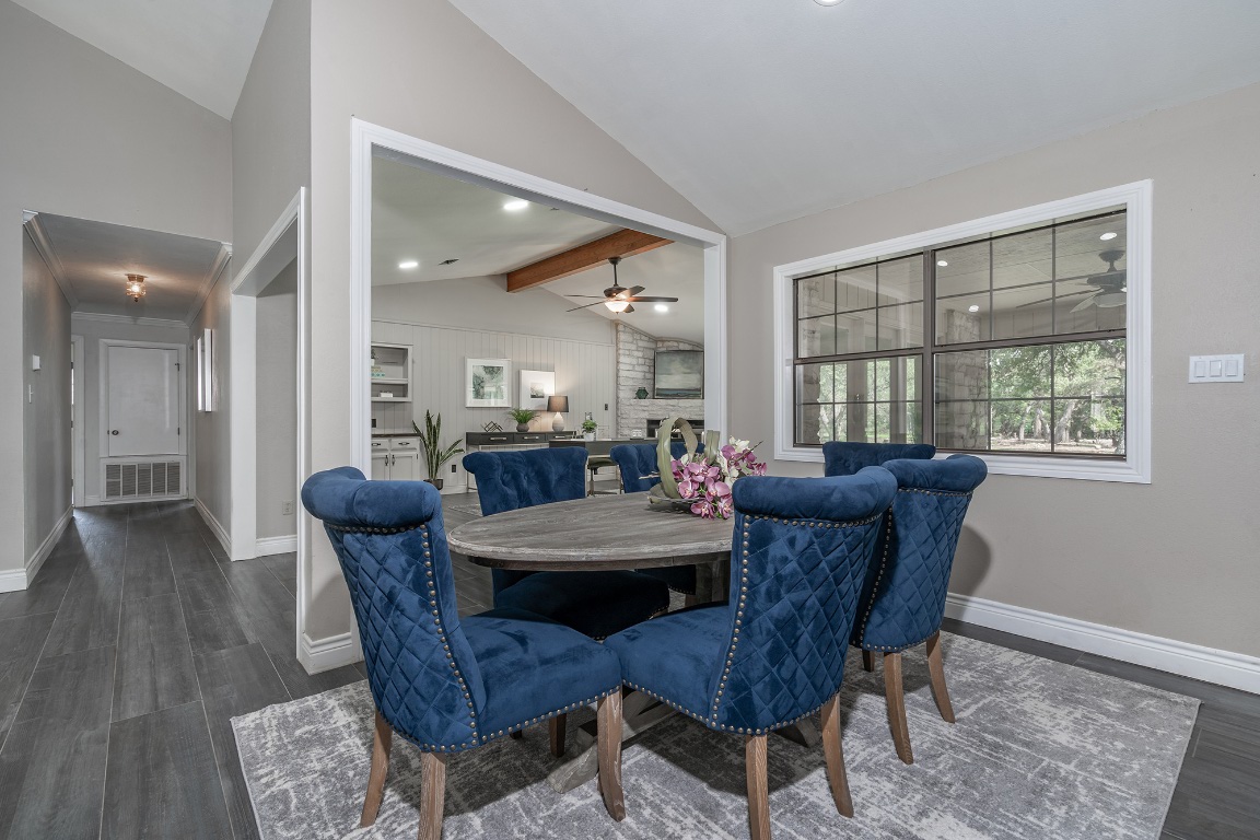 444 Logan Ranch Road Georgetown, TX 78628 - Photo 8 of 36 a view of a dining room with furniture and wooden floor