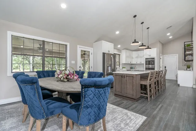 a view of a dining room with furniture and wooden floor