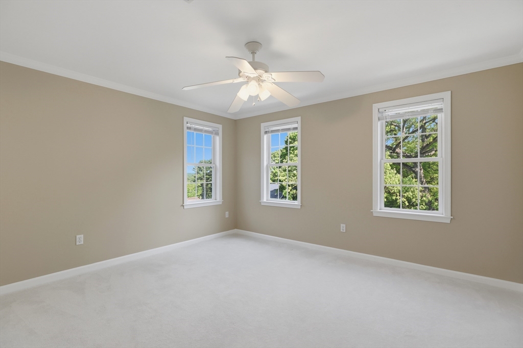 61 Indian Head Road Framingham, MA 01701 - Photo 21 of 42 an empty room with windows and fan