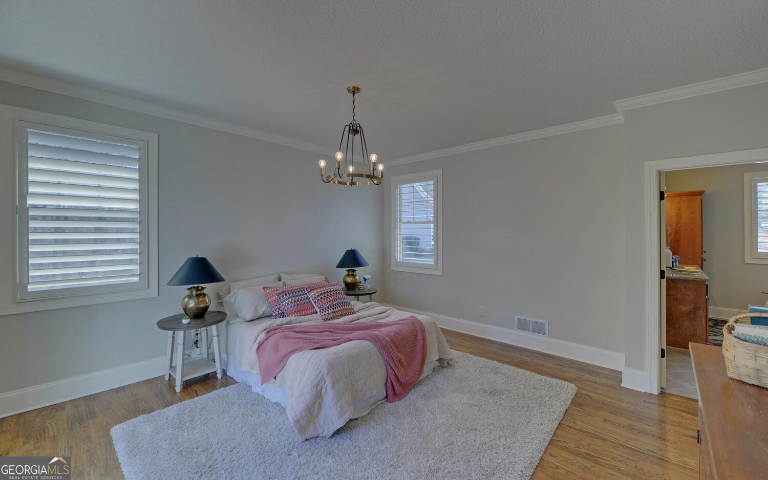 60 Browns Lane Hartwell, GA 30643 - Photo 21 of 89 a bed room with a bed and a chandelier