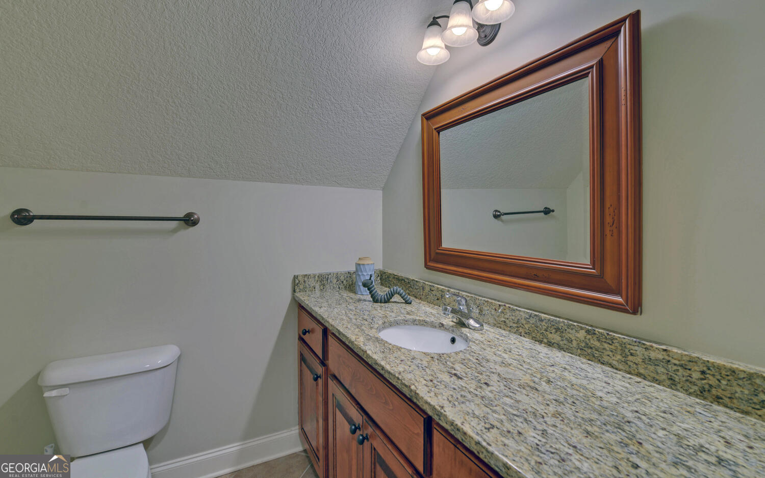 60 Browns Lane Hartwell, GA 30643 - Photo 41 of 89 a bathroom with a granite countertop sink a mirror and a toilet
