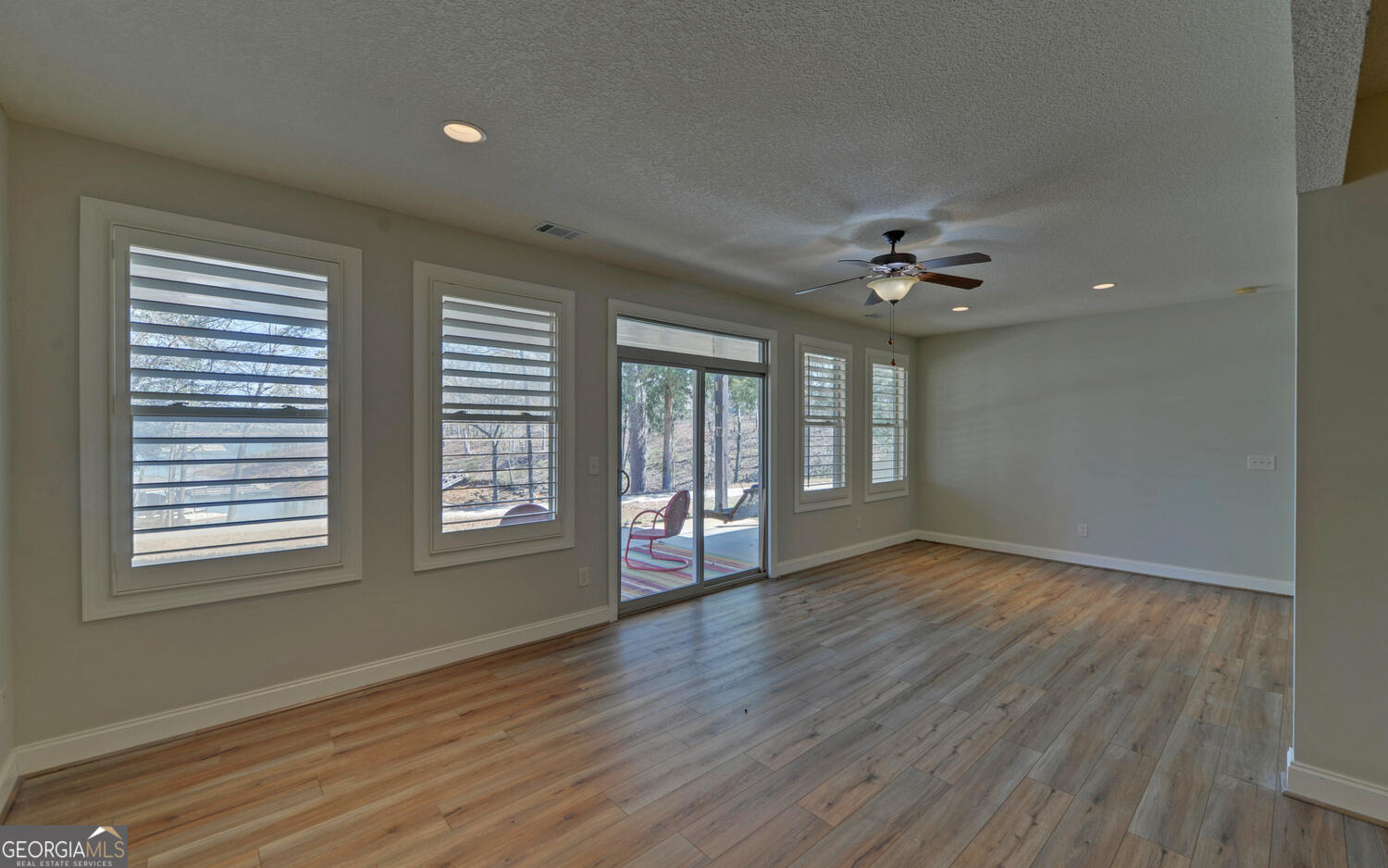 60 Browns Lane Hartwell, GA 30643 - Photo 49 of 89 a view of an empty room with wooden floor and a window