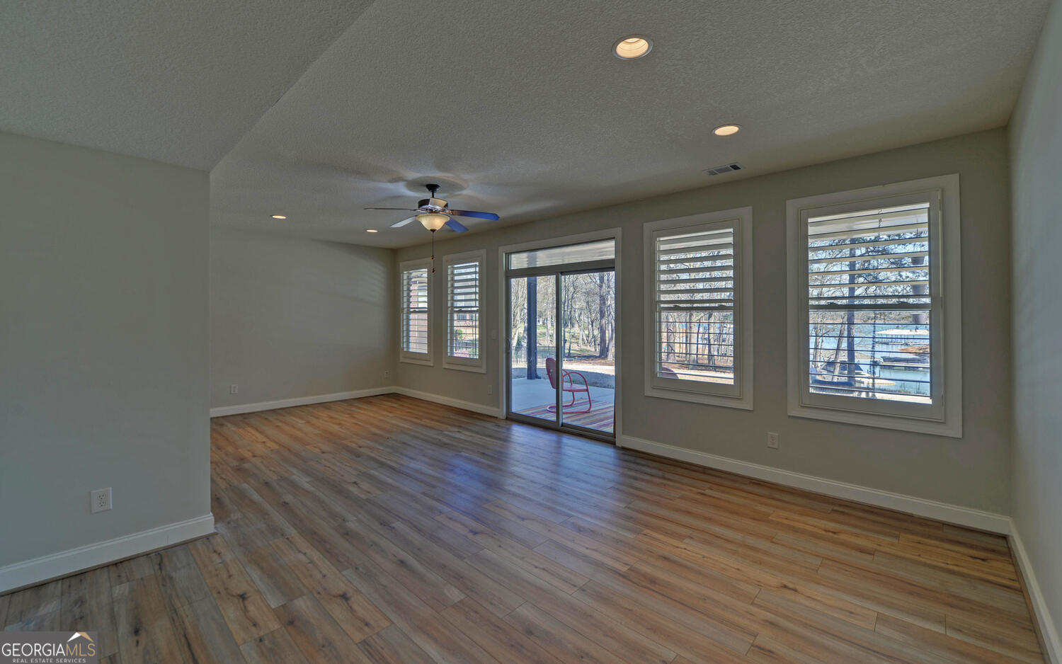 60 Browns Lane Hartwell, GA 30643 - Photo 50 of 89 a view of an empty room with wooden floor and a window
