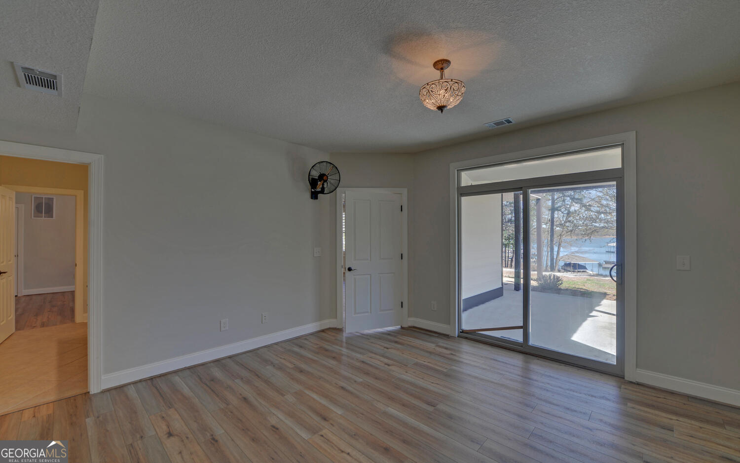 60 Browns Lane Hartwell, GA 30643 - Photo 52 of 89 an empty room with wooden floor and windows