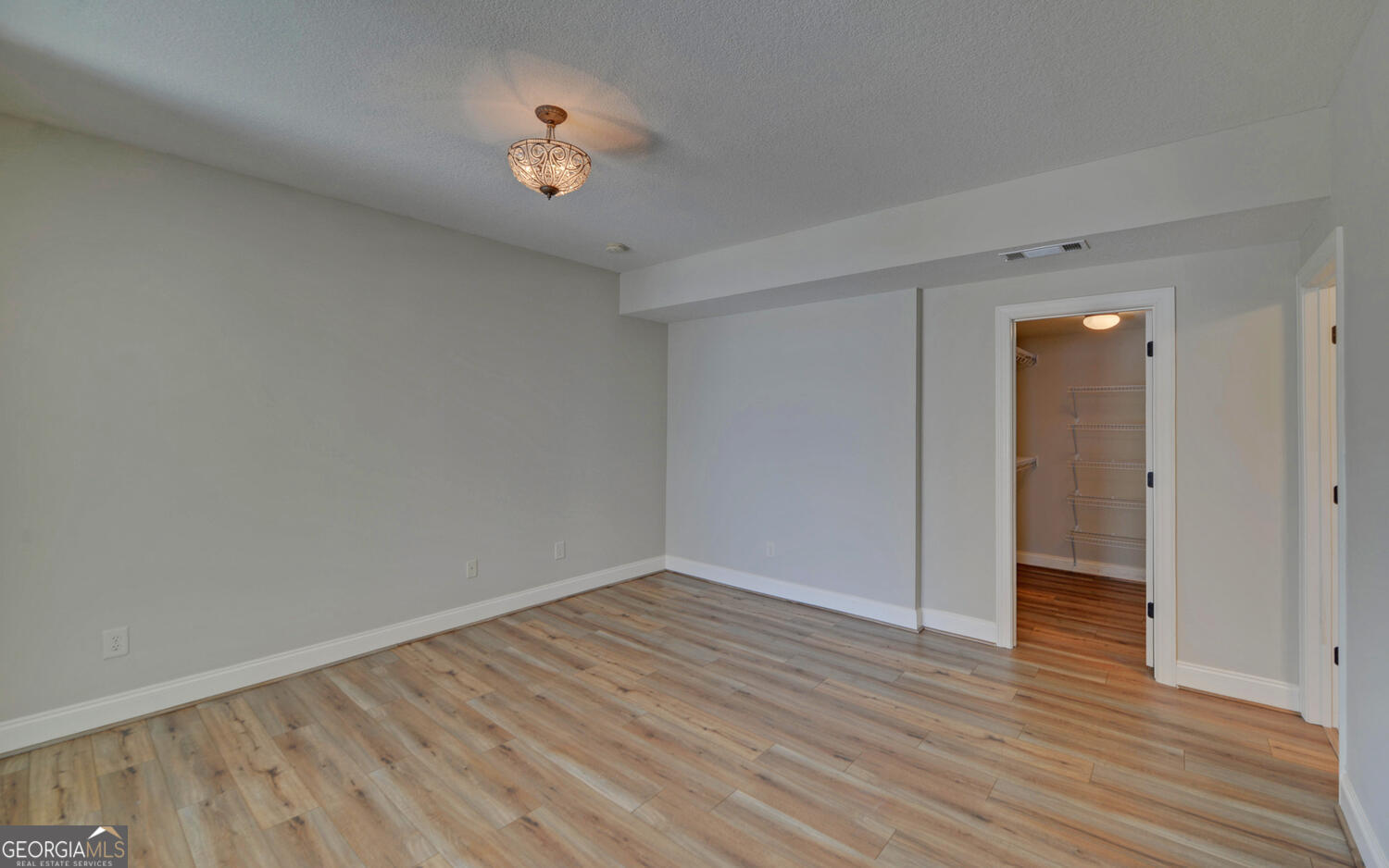 60 Browns Lane Hartwell, GA 30643 - Photo 60 of 89 a view of an empty room with wooden floor and a window